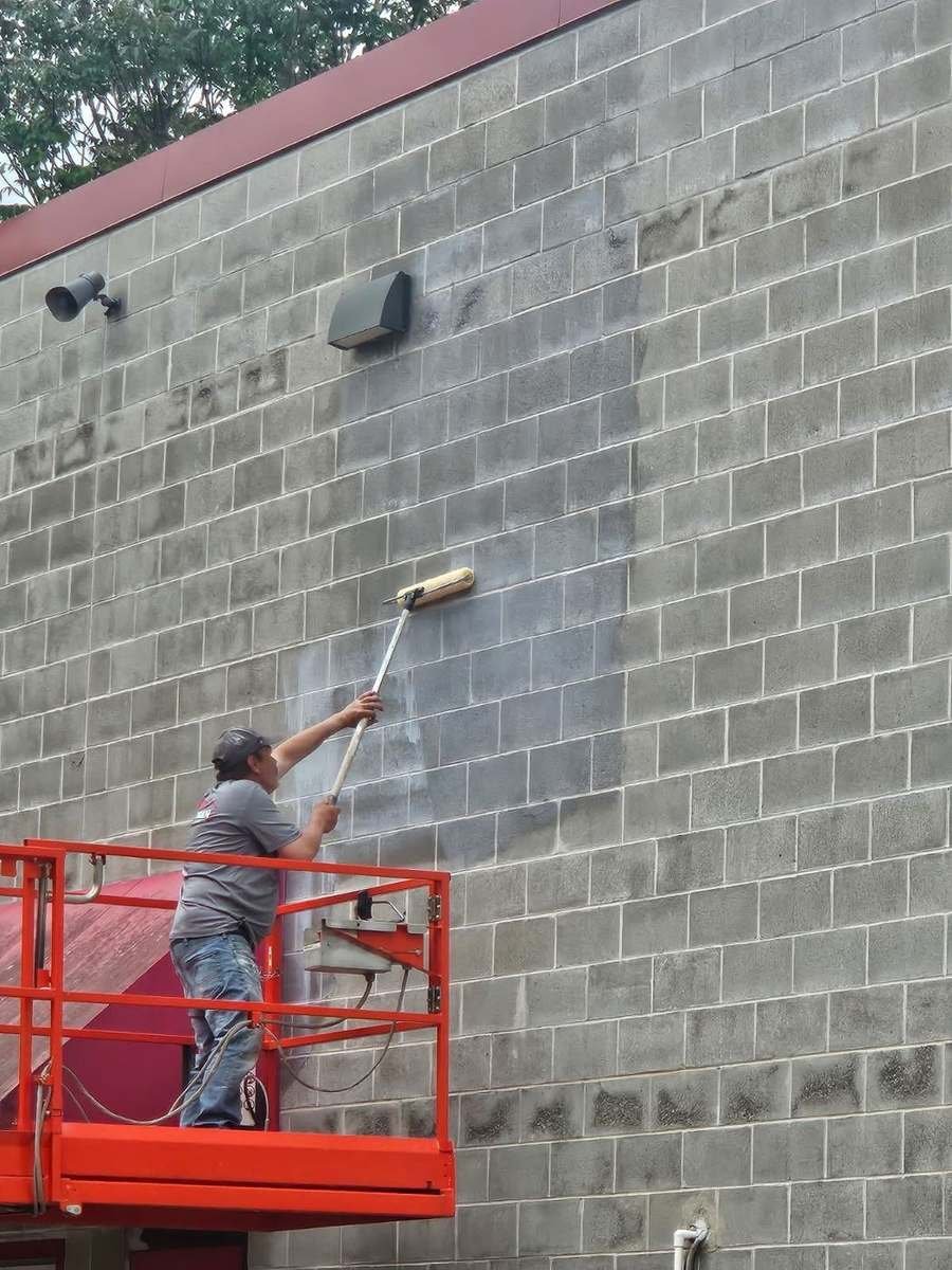 Commercial Lift Work, block wall from a boom lift